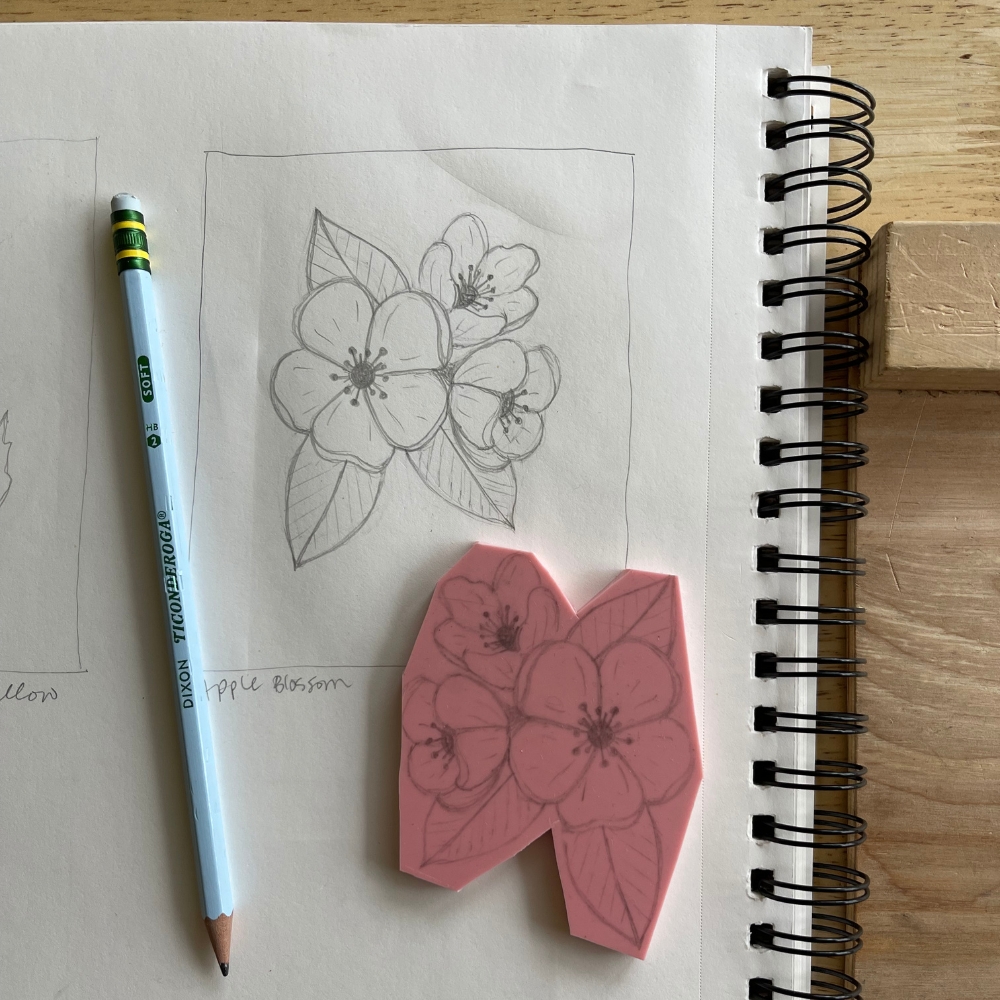 drawing and transfer of an apple tree blossom and a piece of speedball easy carve block